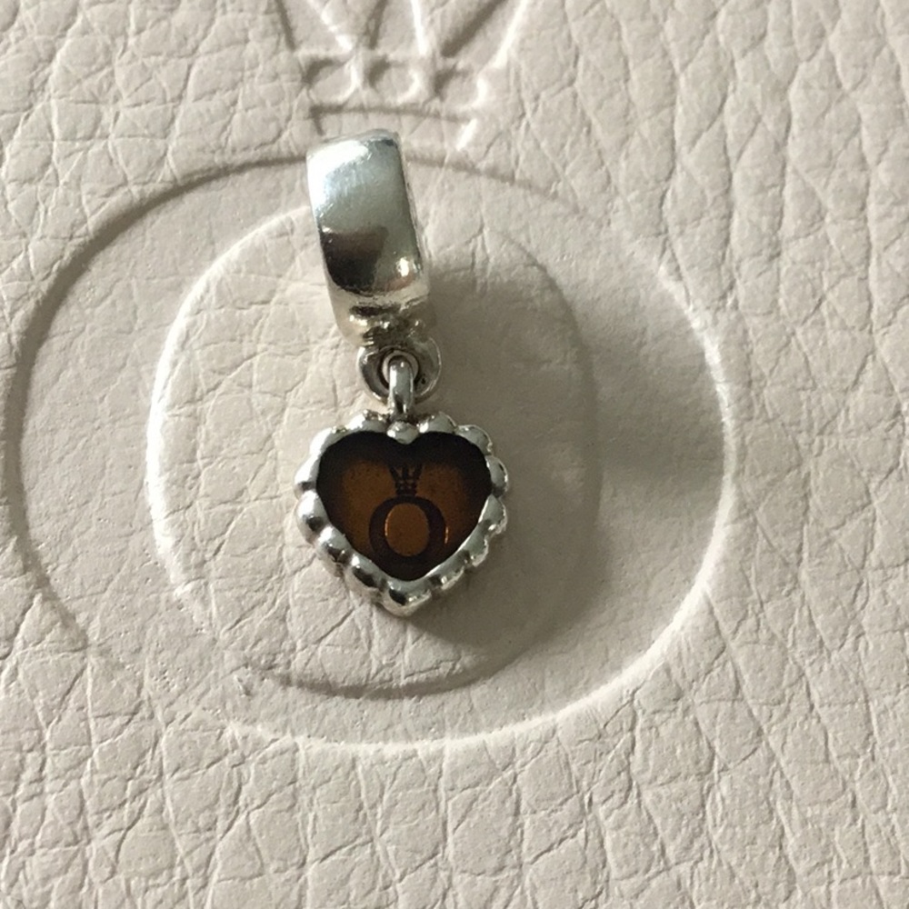 PANDORA Retired symbol inside heart charm